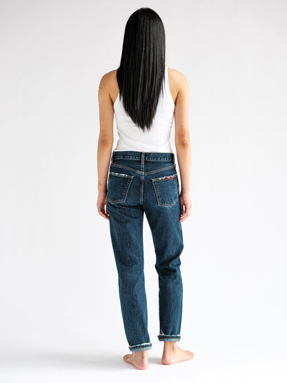 Rear view of the fit model showcasing the B O R O デニム (BORO DENIM) 'Eagle Birds' Tokyo jeans, emphasizing their tailored fit and design inspiration drawn from the Levi's 501 big E.